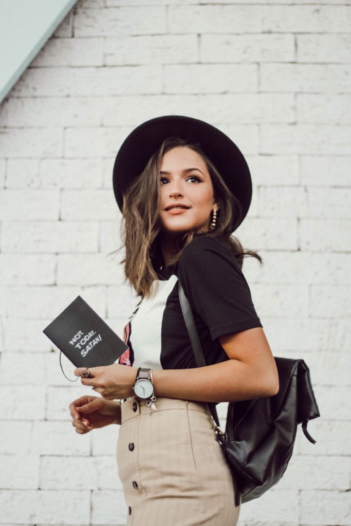 smiling girl holding notebook