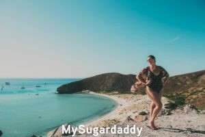 potential Sugar Baby plus size posing with beach in the background