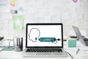 laptop with image that reads e-learning on screen