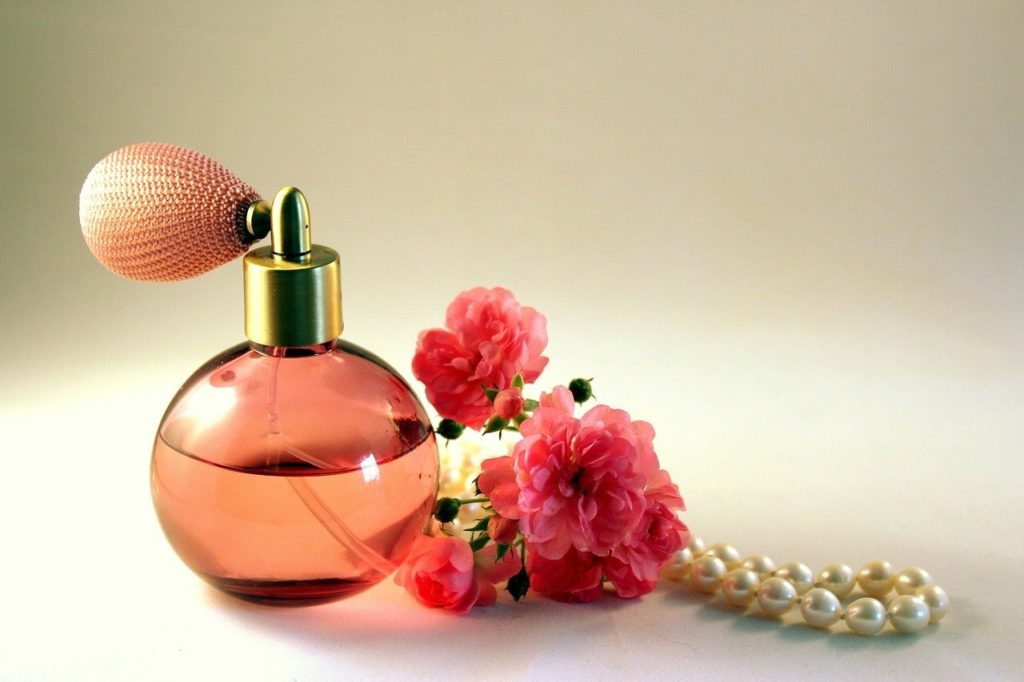 bottle of perfume and flowers