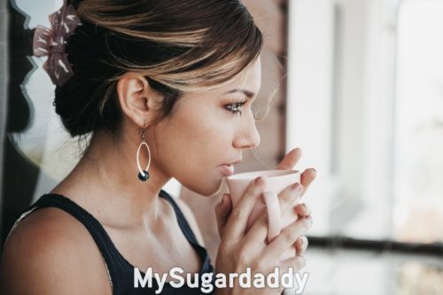 pragmatic sugar baby thinking about her next step while having coffee