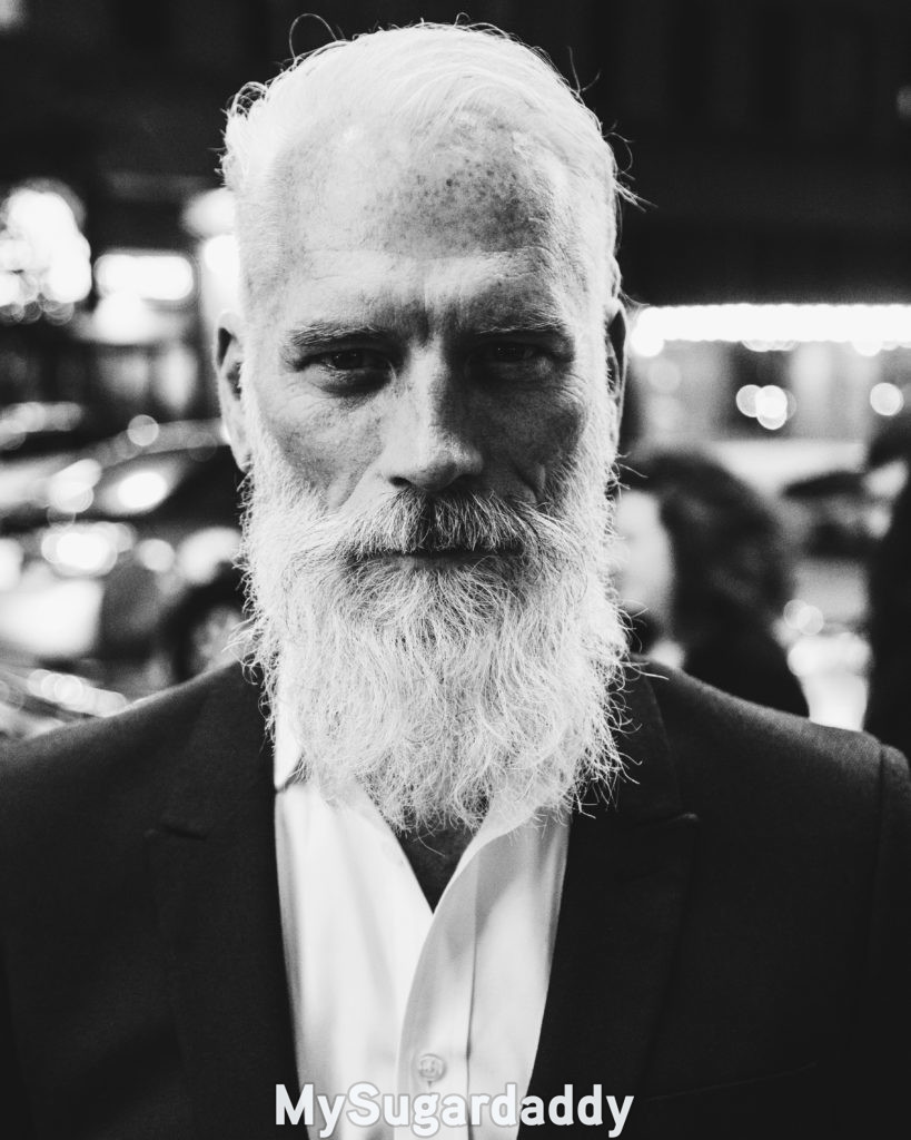 man with white beard and hair in his 40s