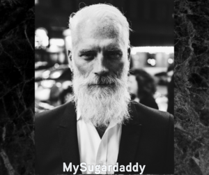 man with white beard and hair in his 40s