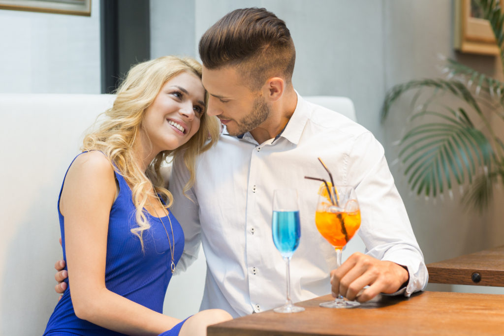 woman smiling at man during small talk