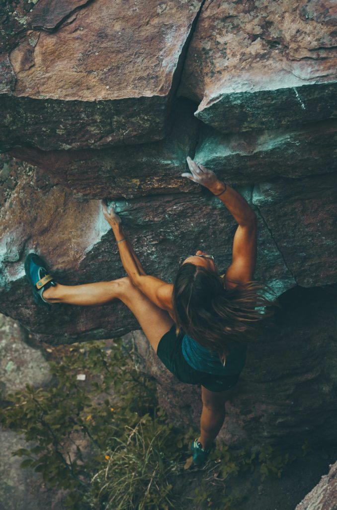 girl climbing as an example of a good sugar baby profile pic.