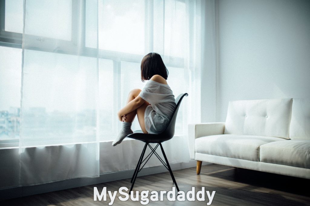 girl who is afraid of change sitting alone in a room in isolation