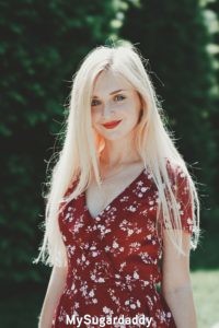 sugar baby wearing a red dress trying to make a good first impression