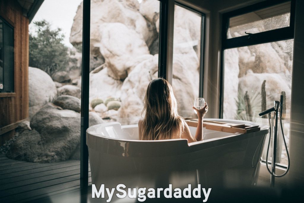 woman in bathtub practicing self-care