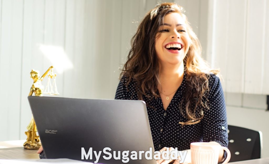 sugar daddy scam: woman smiling after recognizing it