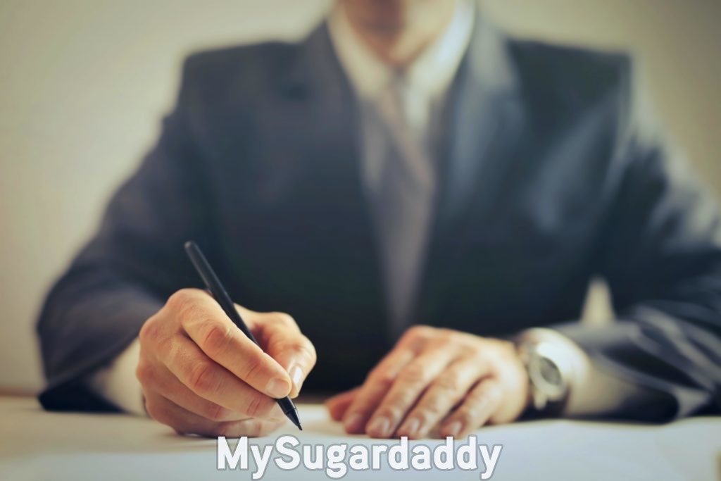 sugar daddy scam man signing payroll as part of the scam