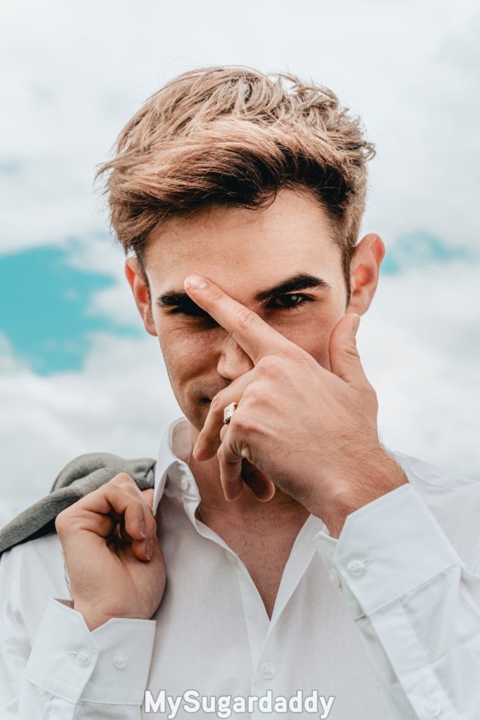 serious sugar daddy posing for portrait for his profile picture