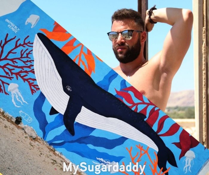 whale daddy representation showing a graffiti of a whale and a shirtless man  